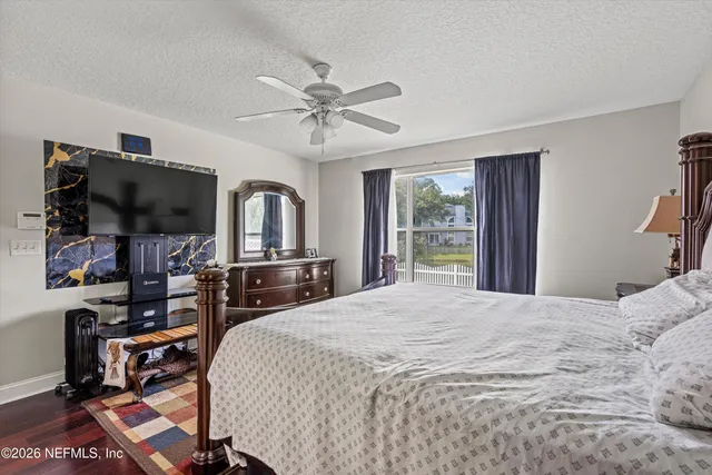 a bedroom with bed and a window