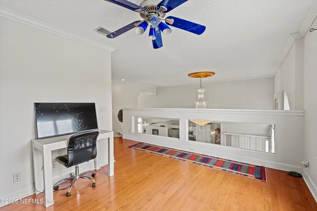 a view of a lake with houses in the back