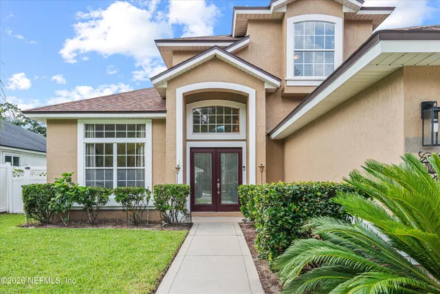 a kitchen with granite countertop a sink and cabinets