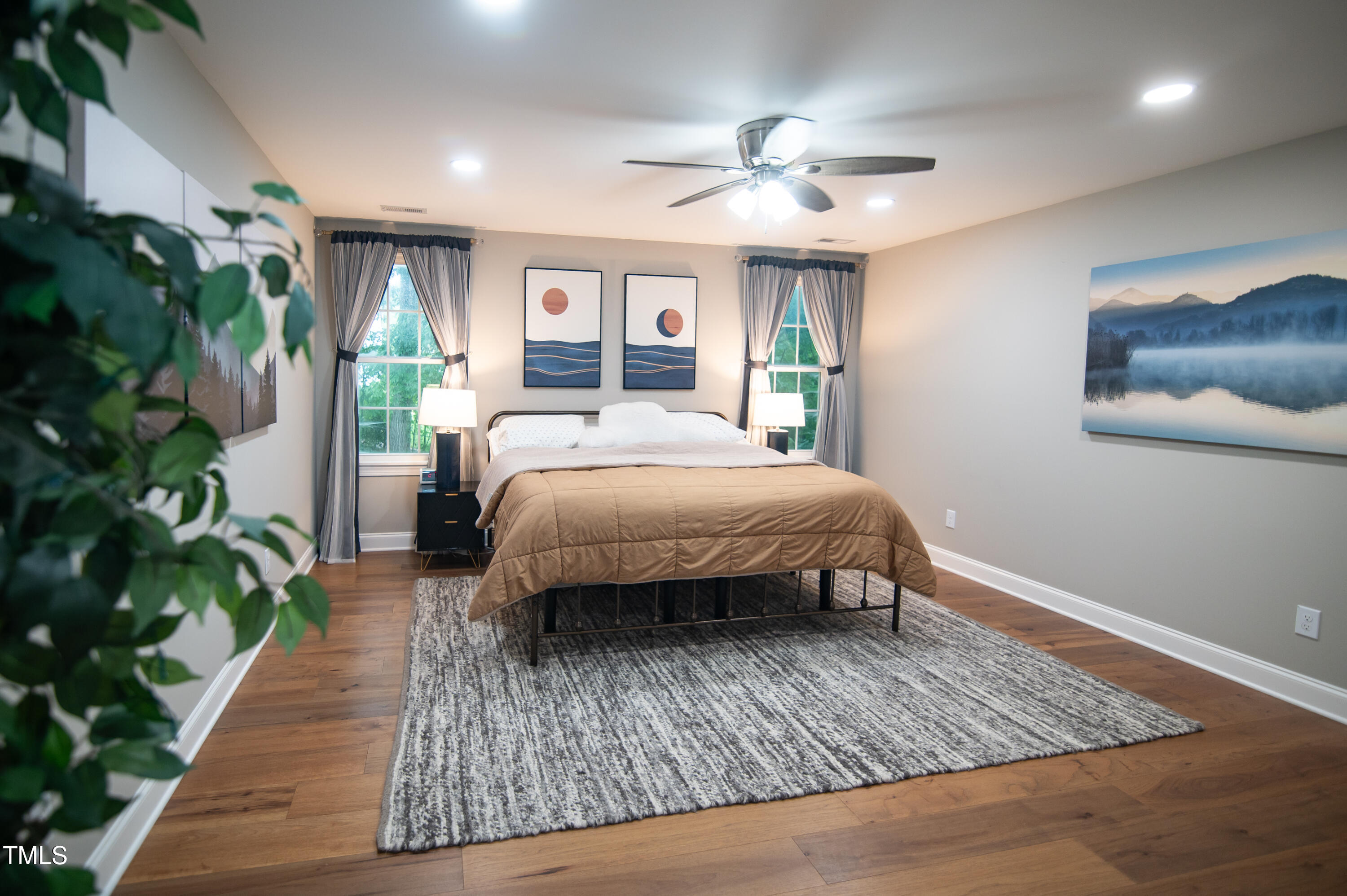 5012 Skidmore Street Raleigh, NC 27609 - Photo 12 of 27 a bed sitting in a spacious bedroom next to a window