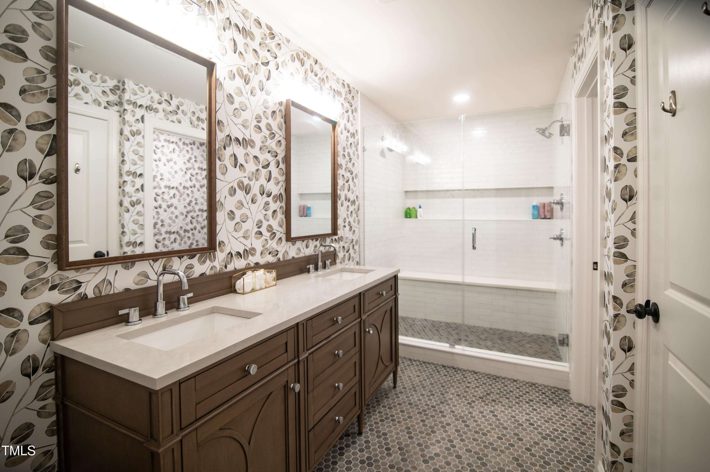 5012 Skidmore Street Raleigh, NC 27609 - Photo 15 of 27 a bathroom with a sink double vanity and a mirror