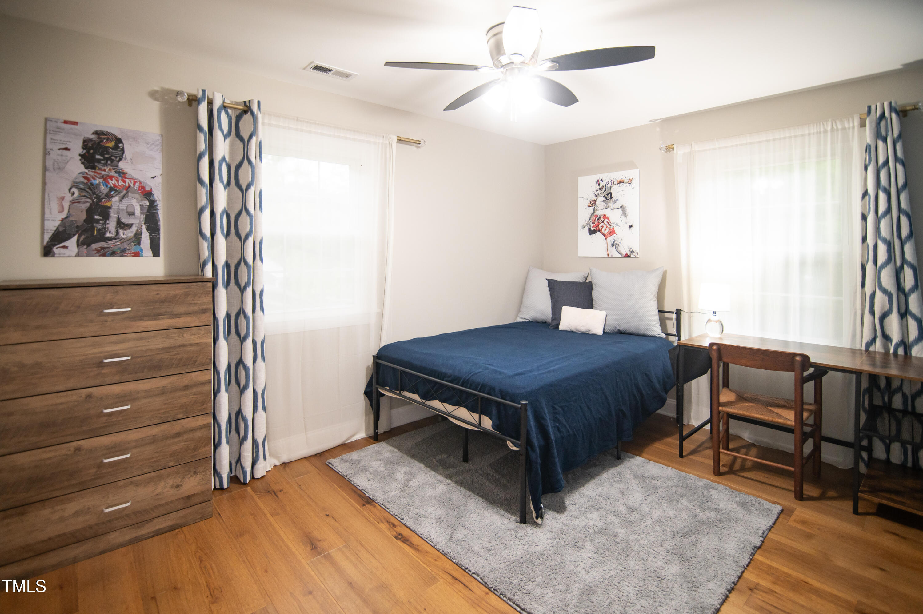 5012 Skidmore Street Raleigh, NC 27609 - Photo 16 of 27 a bedroom with a bed and a window