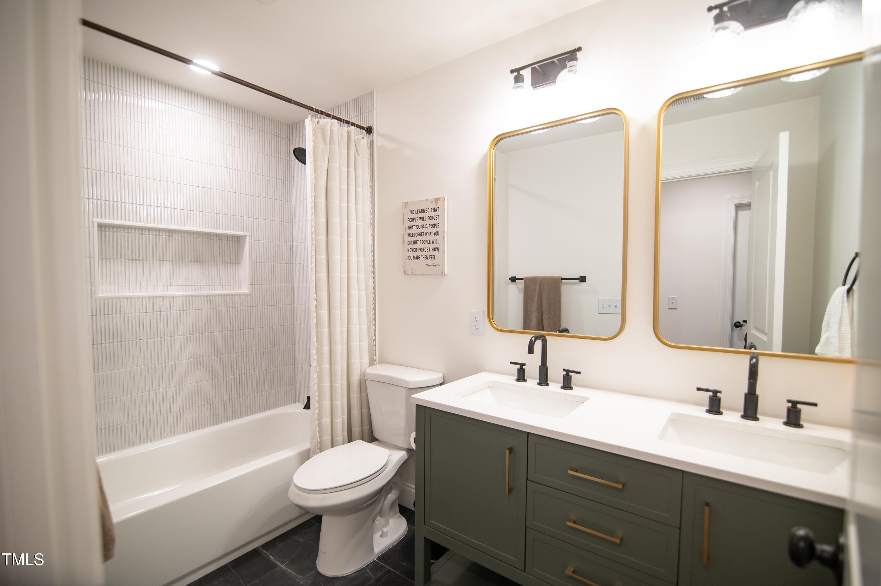 5012 Skidmore Street Raleigh, NC 27609 - Photo 18 of 27 a bathroom with a double vanity sink toilet and shower