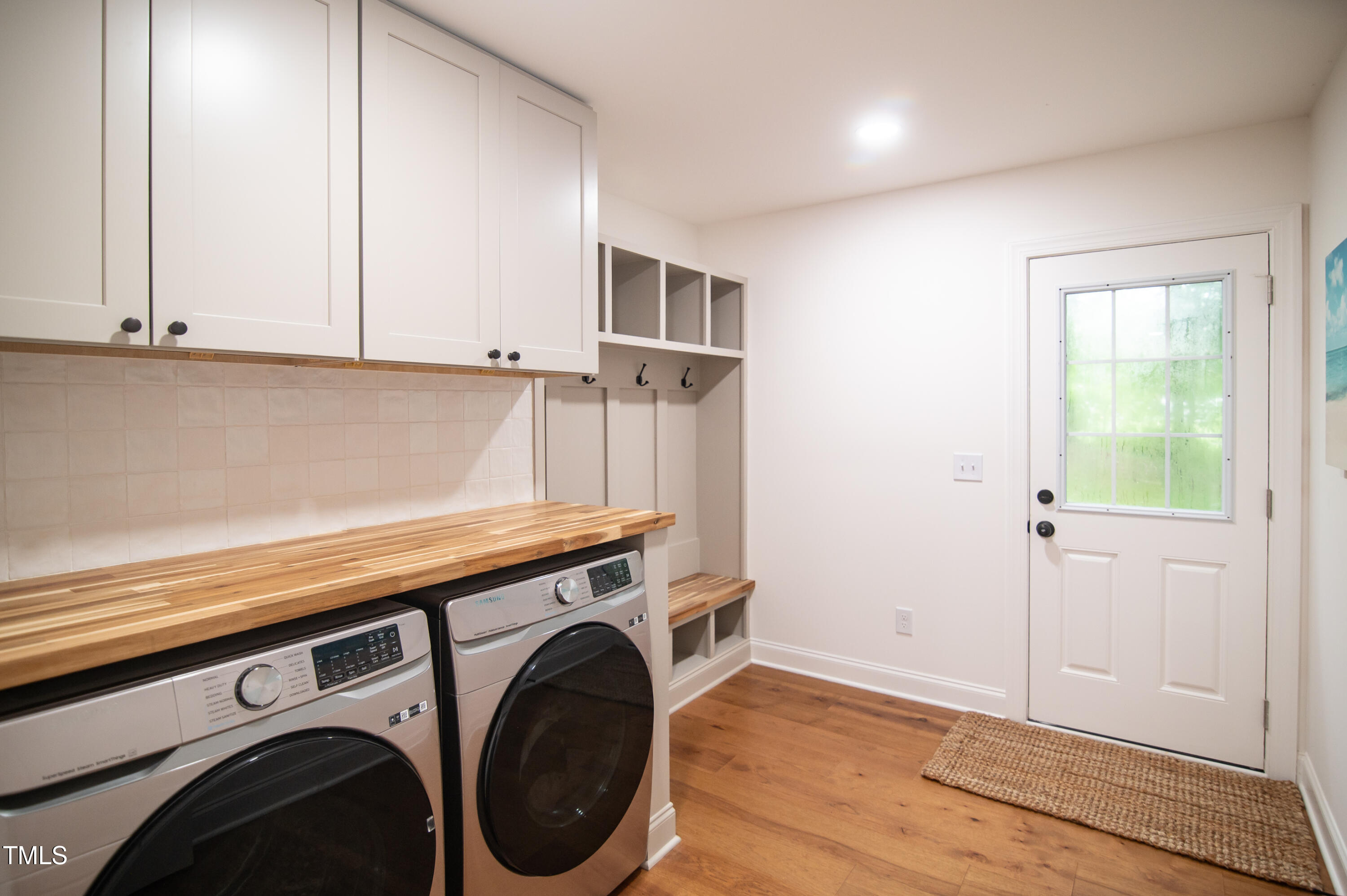 5012 Skidmore Street Raleigh, NC 27609 - Photo 23 of 27 a view of storage and utility room with washer and dryer