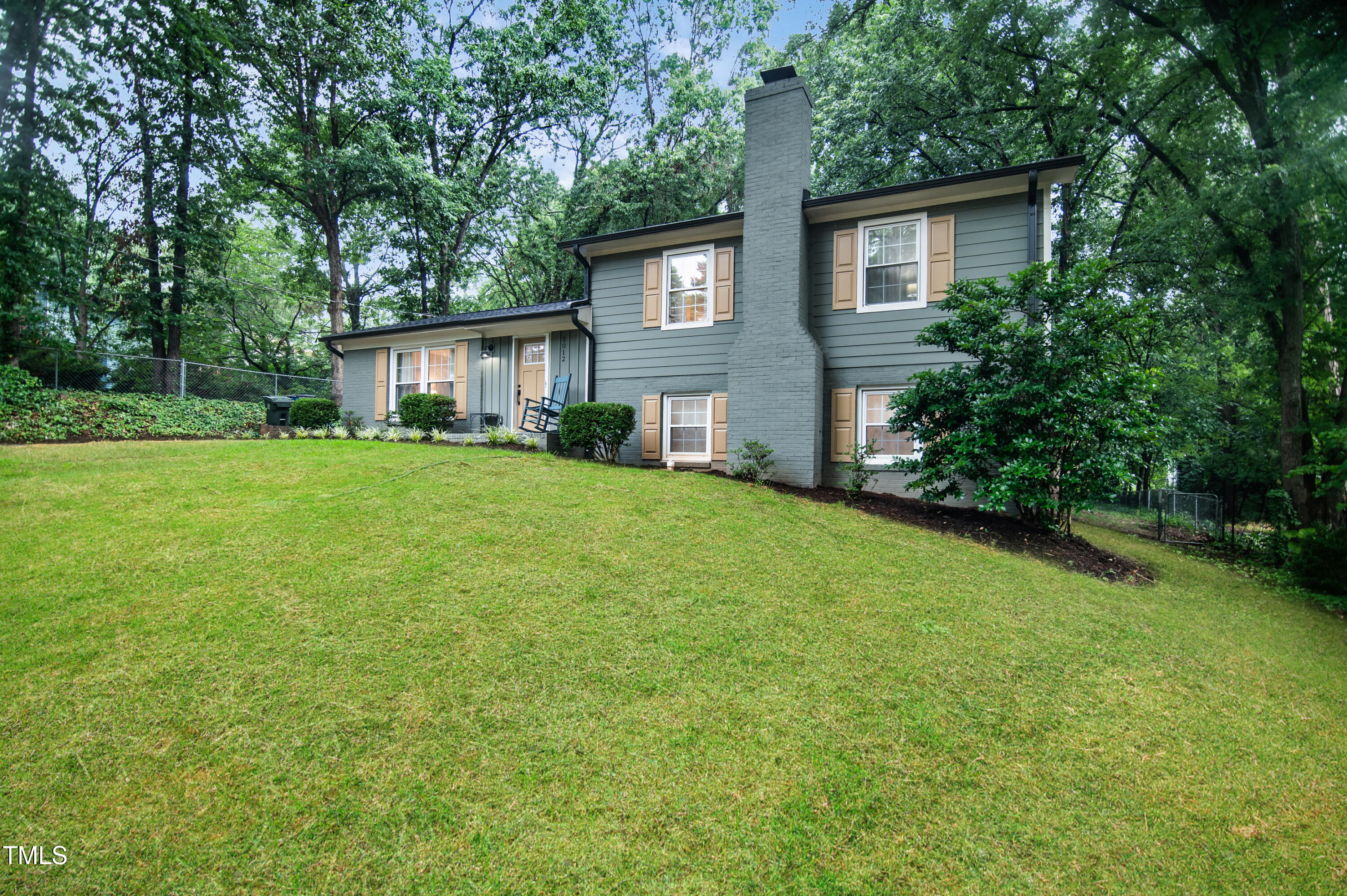 5012 Skidmore Street Raleigh, NC 27609 - Photo 2 of 27 a view of a house with a backyard
