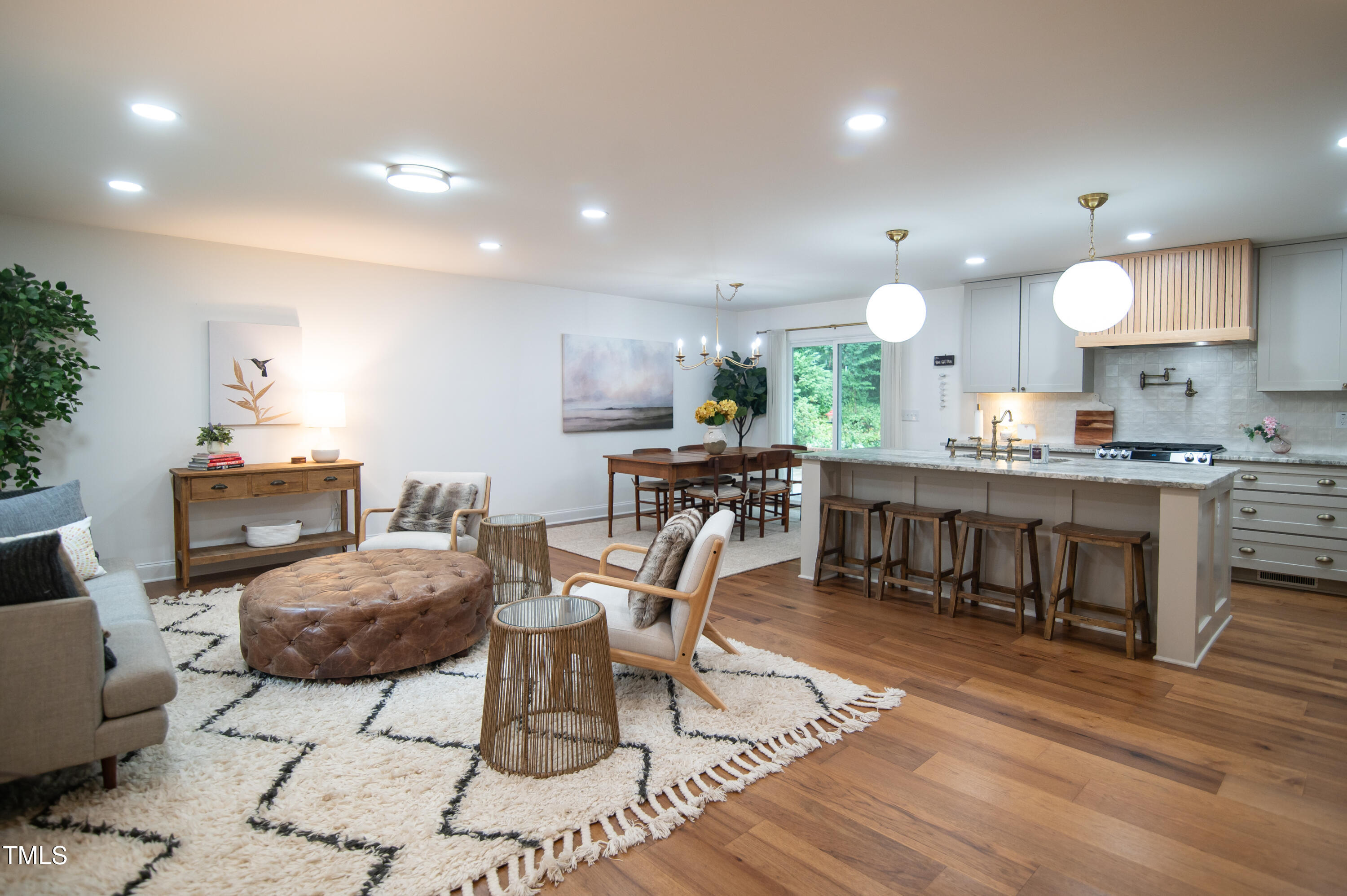 5012 Skidmore Street Raleigh, NC 27609 - Photo 4 of 27 a view of a dining room with furniture and wooden floor