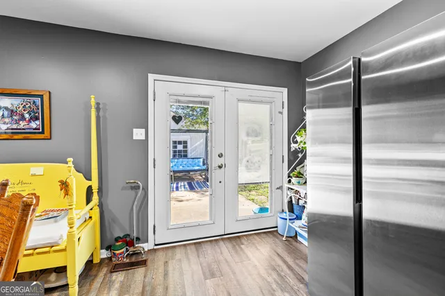 a view of an entryway with wooden floor