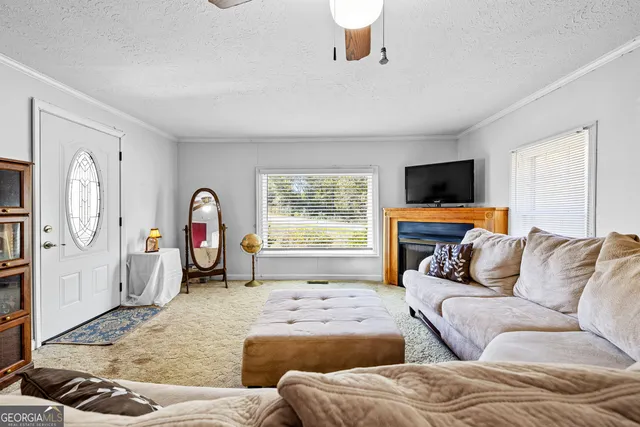 a living room with furniture cabinets and a book shelf
