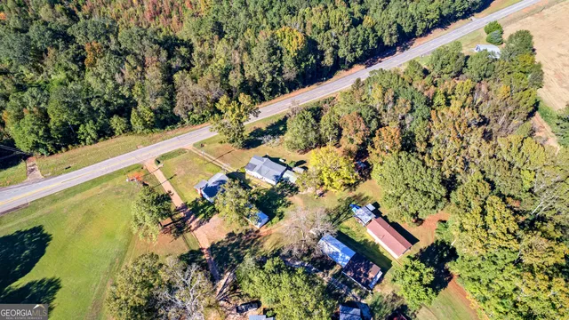 a house view with swimming pool in front of it