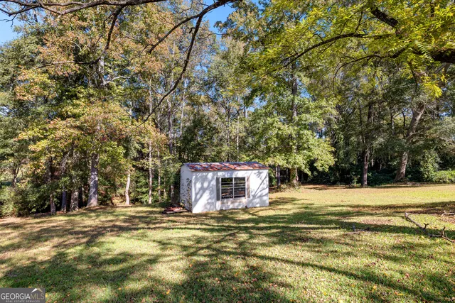 a view of a yard with a tree