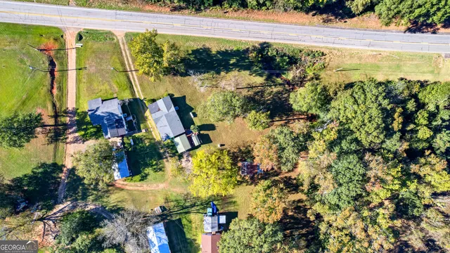a view of a yard with a tree