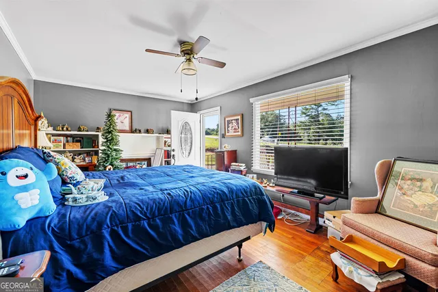 a bedroom with furniture and a window