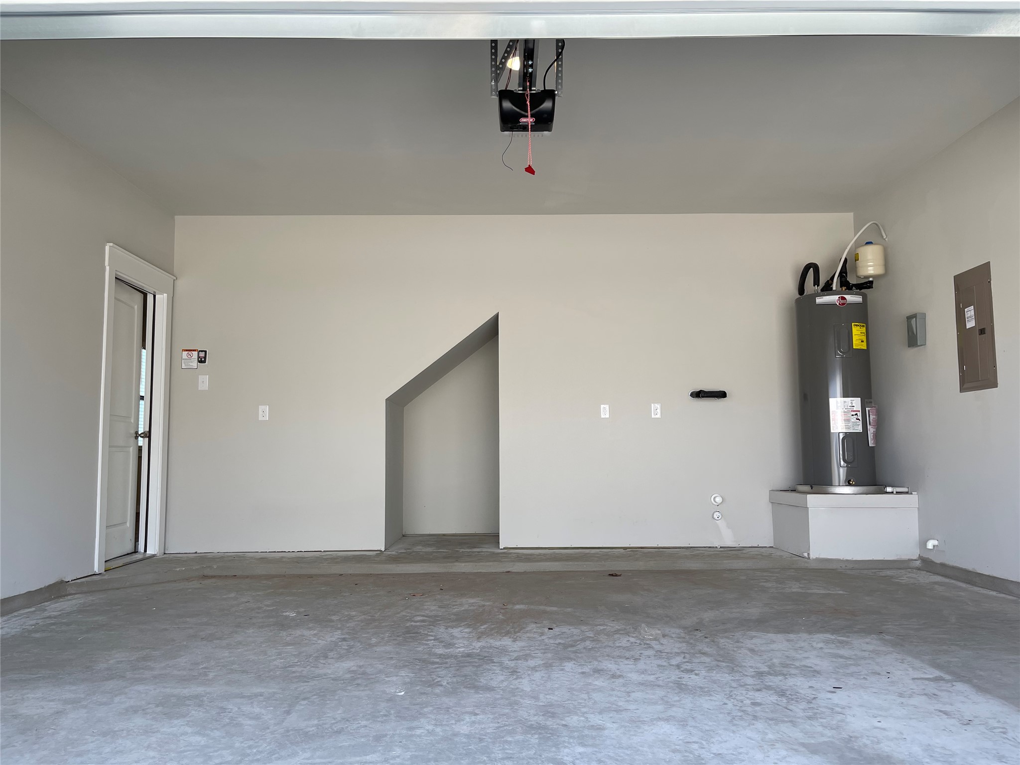 147 Waterside Road, Unit A Buda, TX 78610 - Photo 25 of 27 Secure parking and ample storage in this well-maintained garage.
