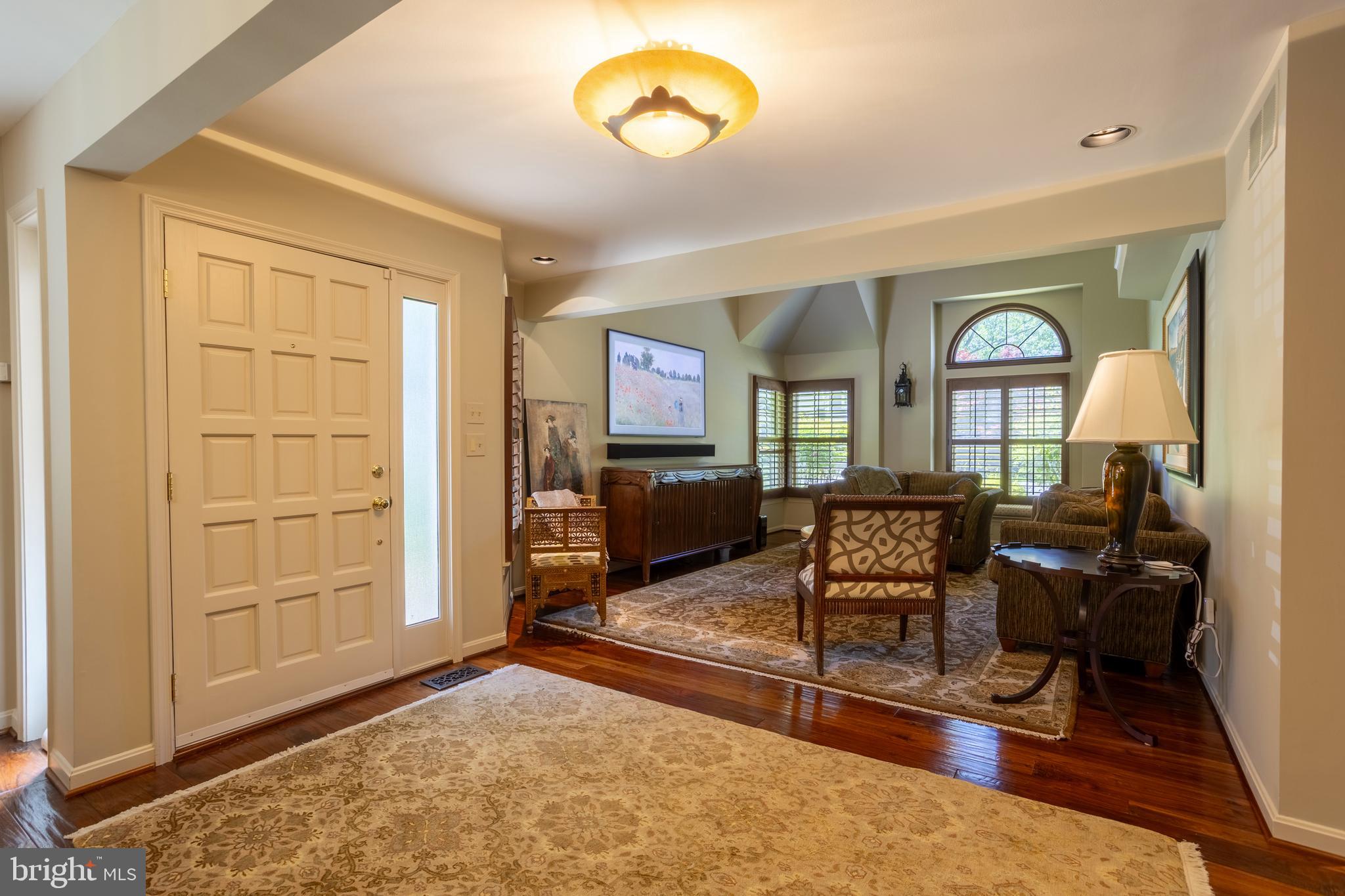 63 Raisin Tree Circle Baltimore, MD 21208 - Photo 5 of 57 a living room with furniture a rug and a window