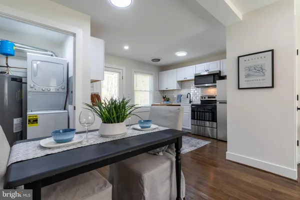 a kitchen with a table and chairs in it