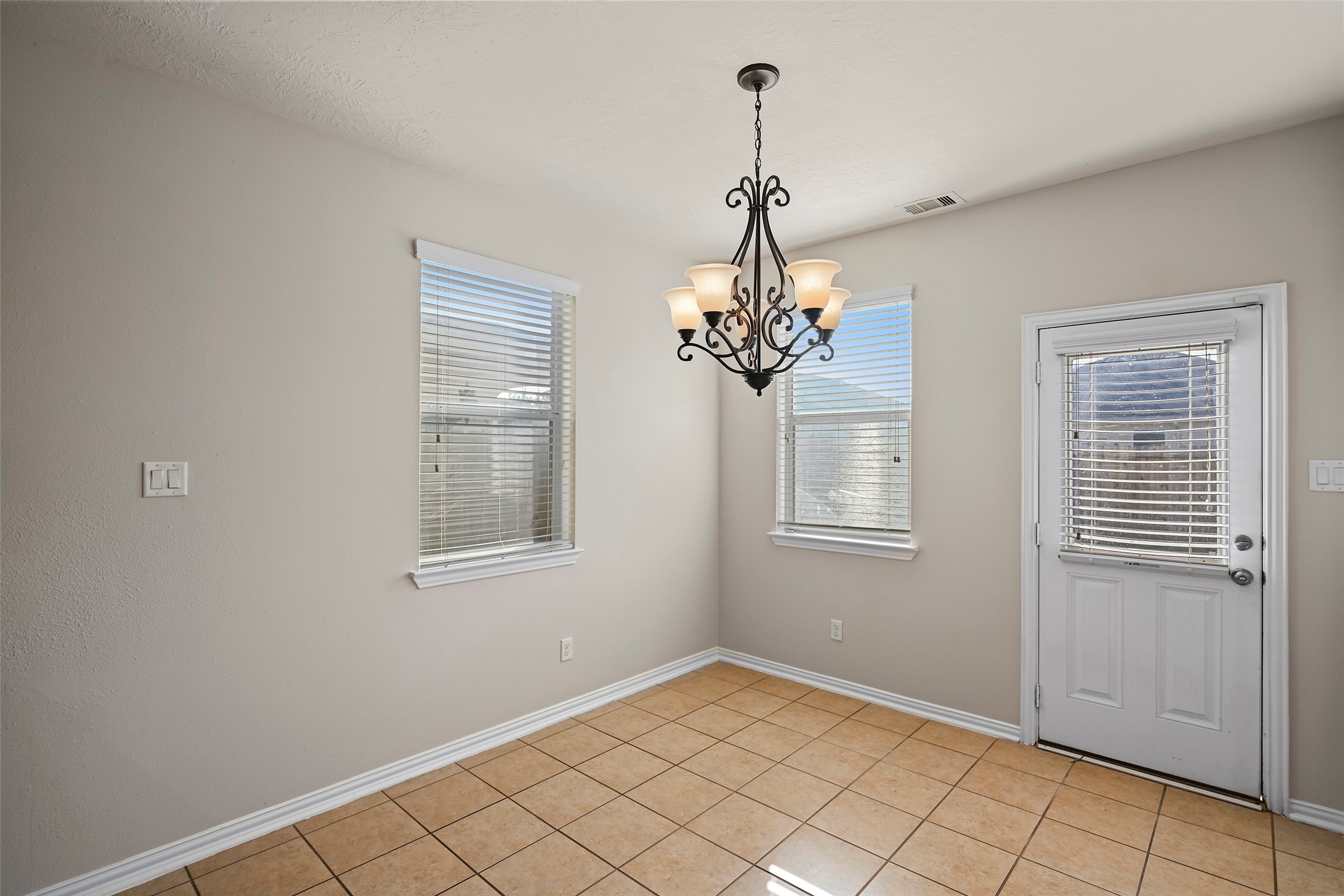 8323 Rudy Brook Way Spring, TX 77379 - Photo 13 of 35 a view of an empty room with a window