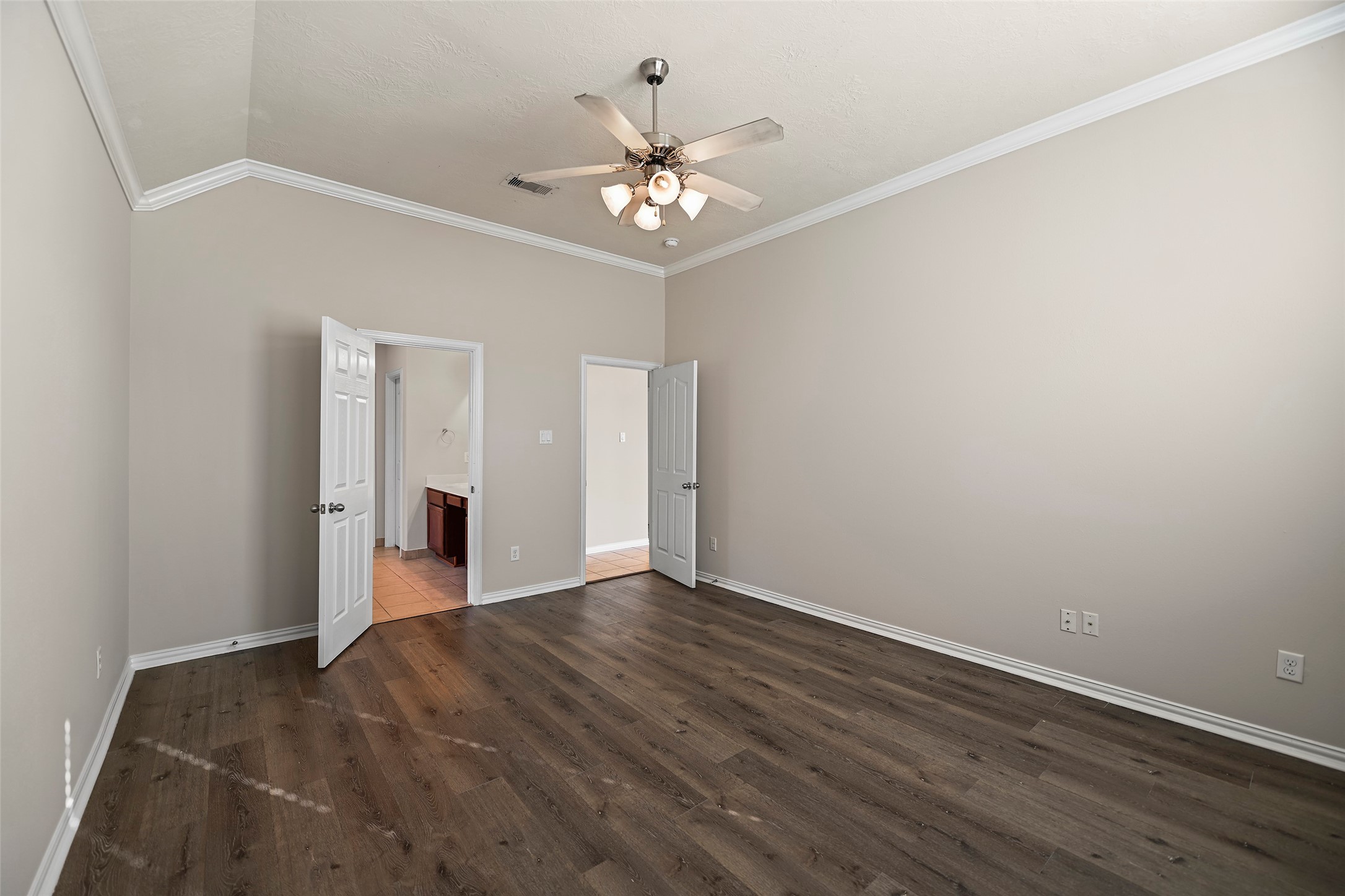 8323 Rudy Brook Way Spring, TX 77379 - Photo 16 of 35 a view of an empty room with chandelier fan and wooden floor
