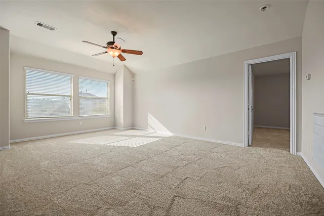 a view of empty room with windows