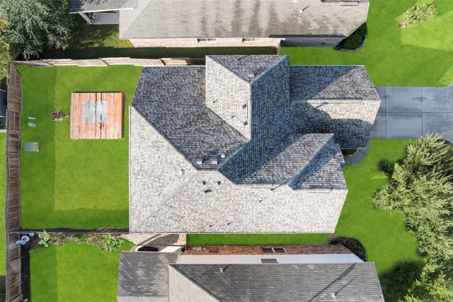 an aerial view of a house with a garden
