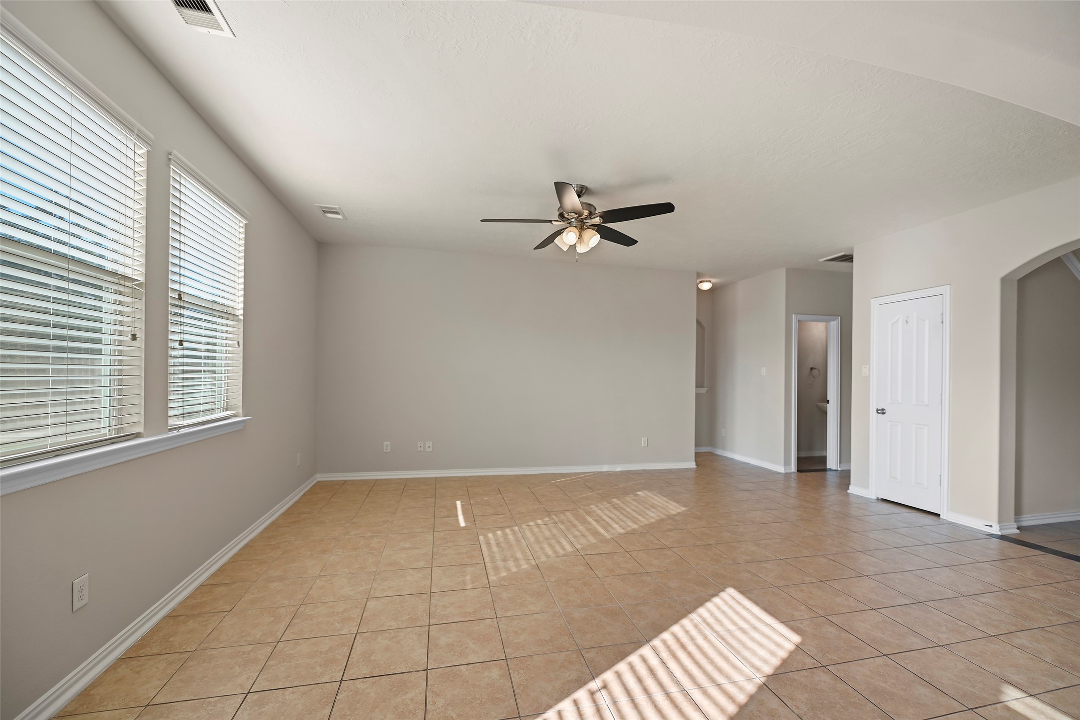 8323 Rudy Brook Way Spring, TX 77379 - Photo 8 of 35 a view of an empty room with a window