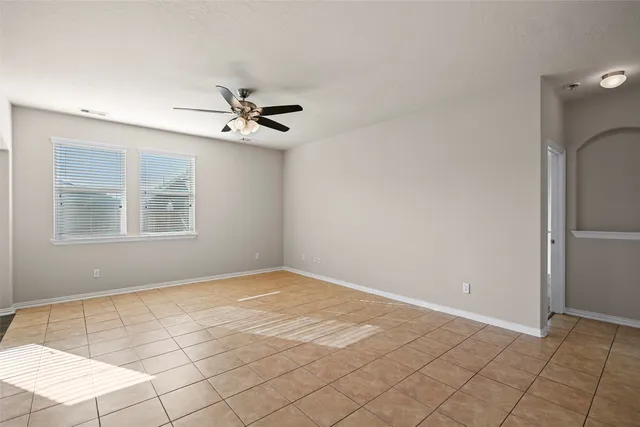 a view of an empty room with windows