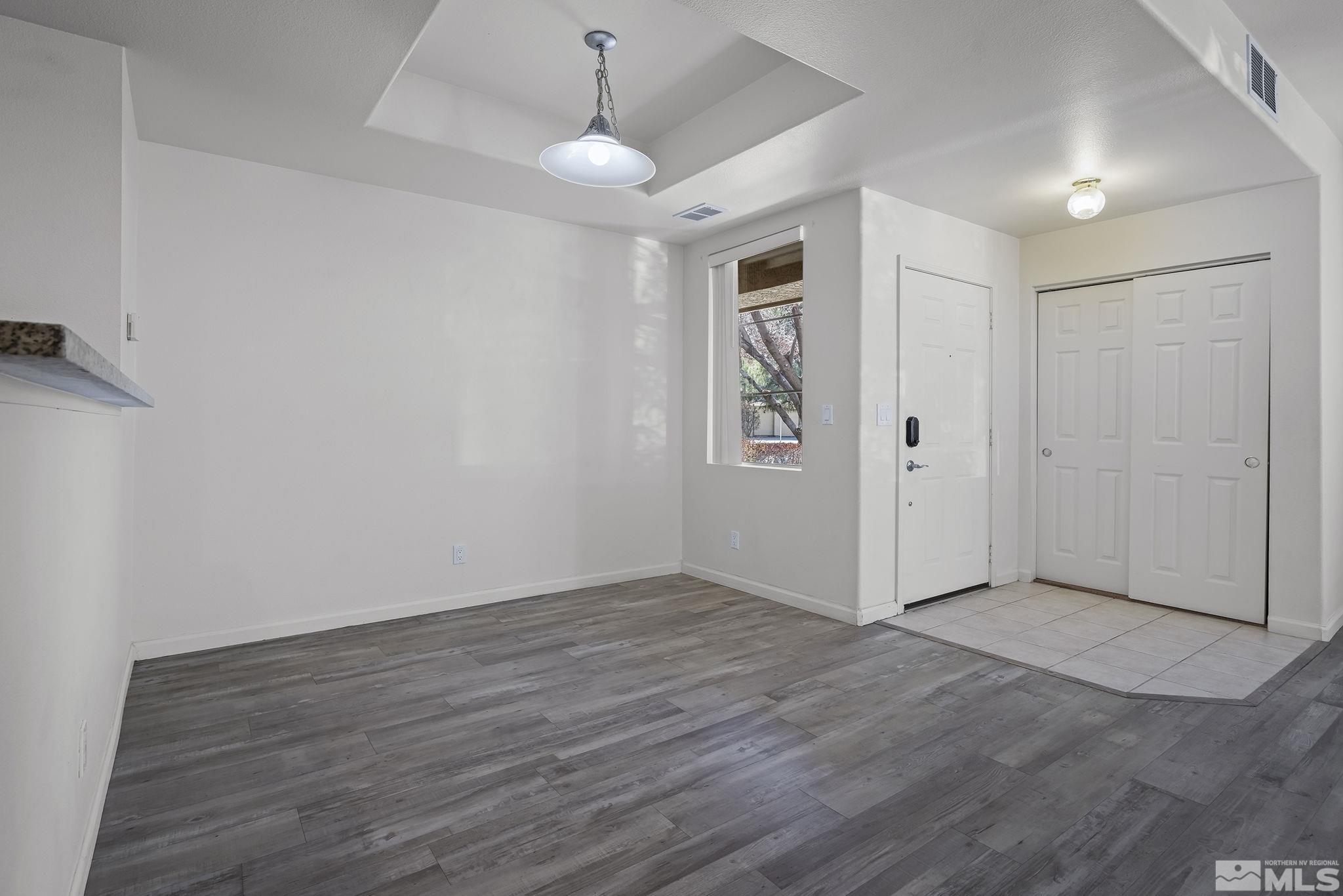 900 S Meadows, Unit 2911 Reno, NV 89521 - Photo 7 of 27 wooden floor in an empty room with a window