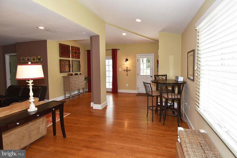 306 Indian Spring Drive Silver Spring, MD 20901 - Photo 2 of 30 a view of a dining room with furniture and wooden floor