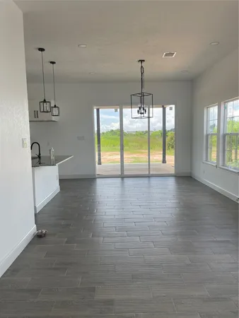 a view of an empty room and window