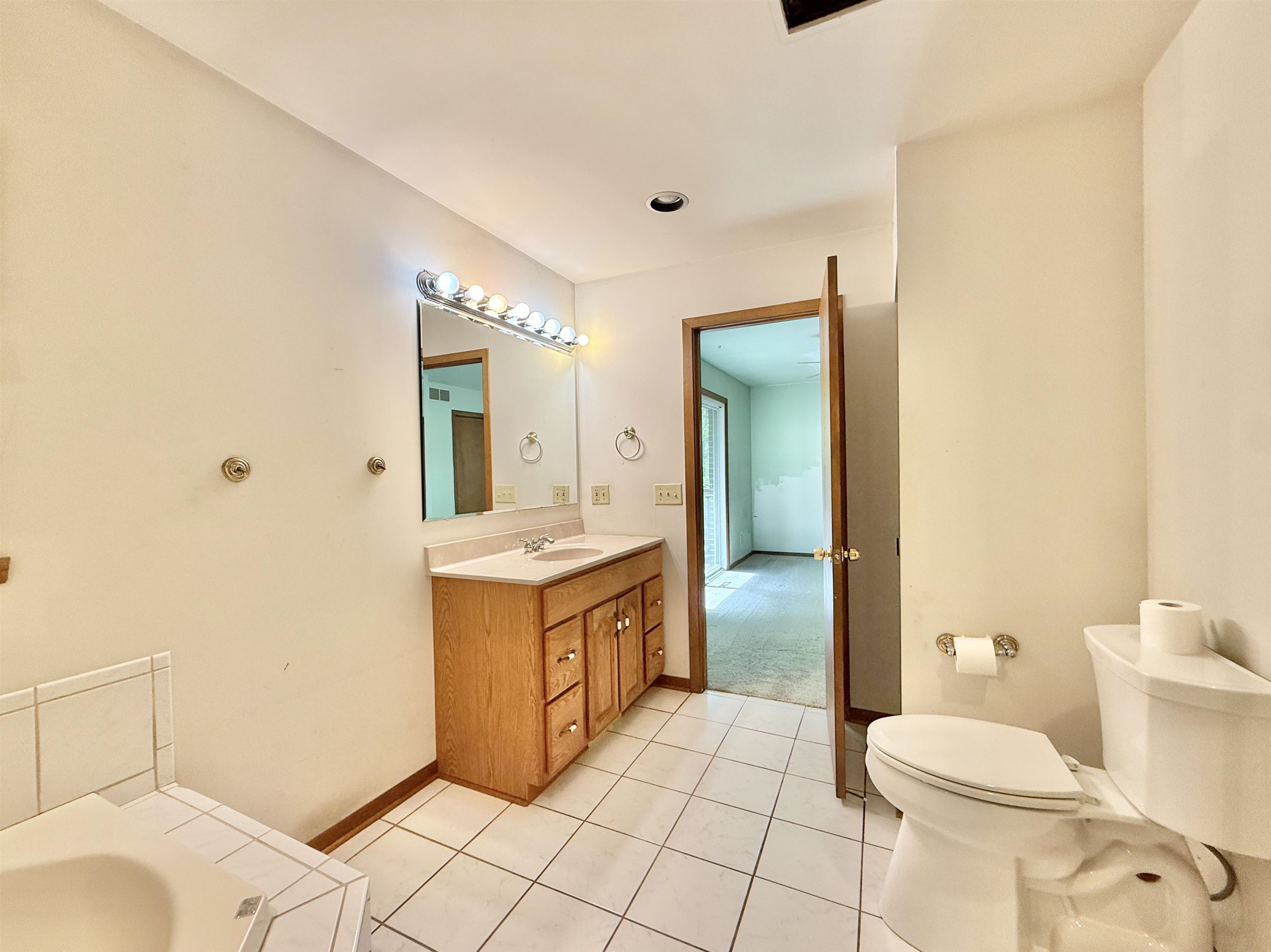 3620 Valerie Road Roscoe, IL 61073 - Photo 11 of 26 a bathroom with a sink a toilet and shower