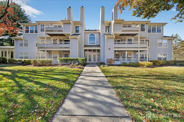 a front view of building with yard