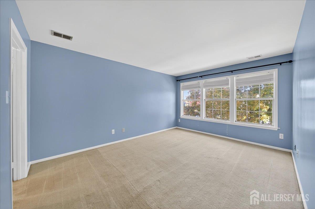 306 Trinity Court, Unit 12 Princeton, NJ 08540 - Photo 13 of 26 an empty room with windows