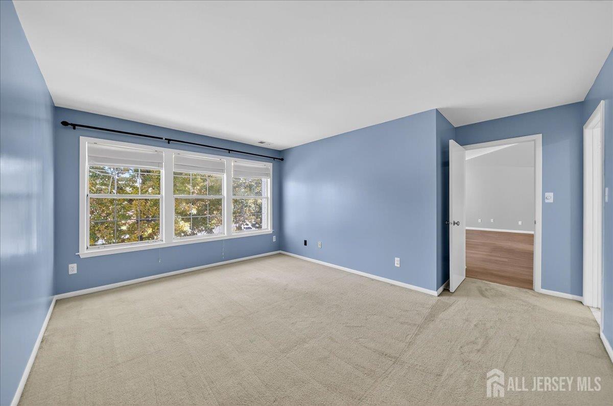 306 Trinity Court, Unit 12 Princeton, NJ 08540 - Photo 15 of 26 an empty room with windows and closet
