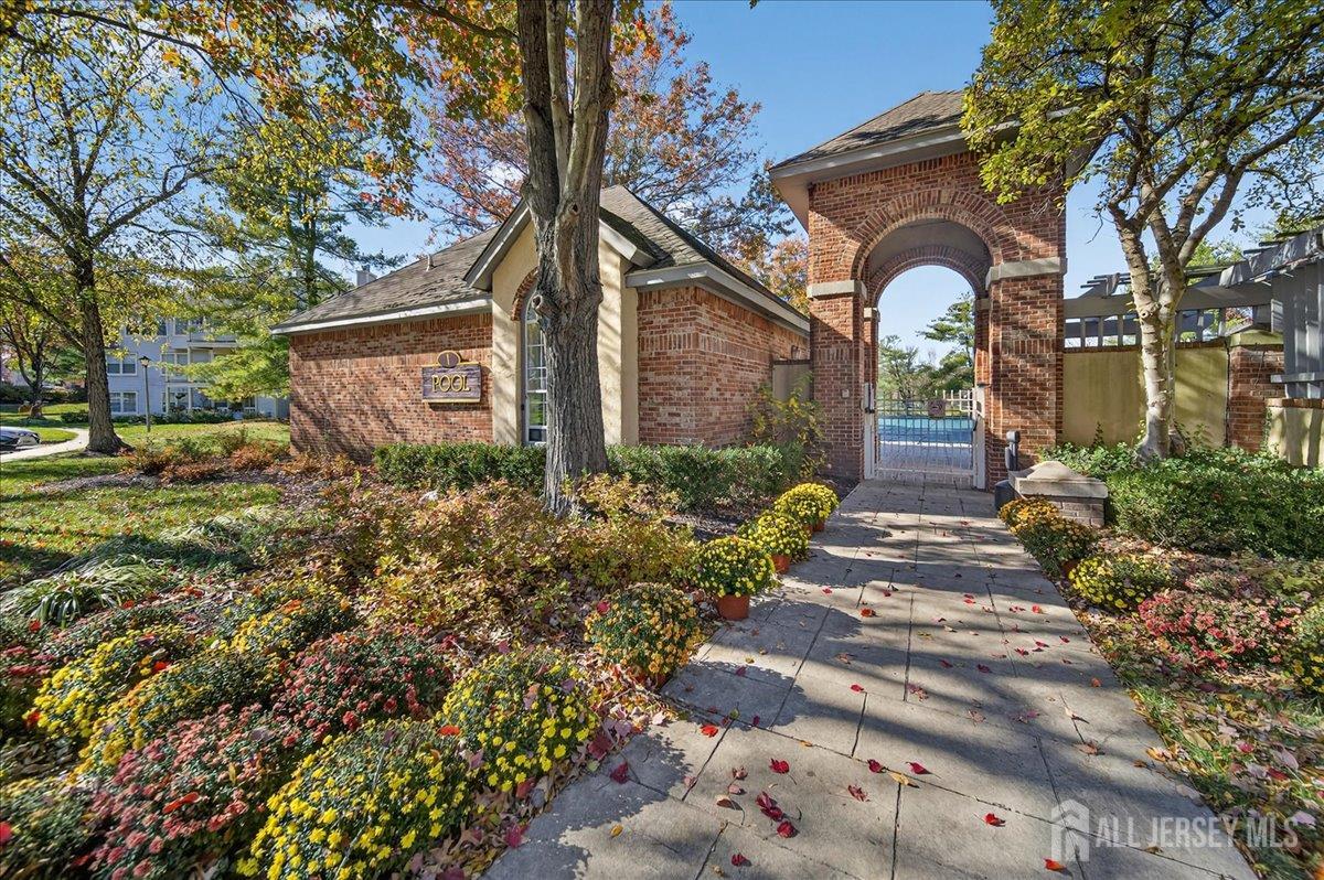 306 Trinity Court, Unit 12 Princeton, NJ 08540 - Photo 23 of 26 a front view of a house with garden