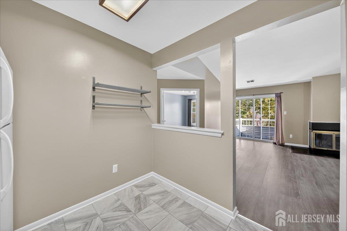 306 Trinity Court, Unit 12 Princeton, NJ 08540 - Photo 7 of 26 a view of livingroom with hardwood floor and window