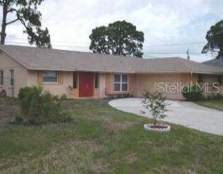 1259 Ringtail Road Venice, FL 34293 - Photo 1 of 1 a front view of house with yard and outdoor seating