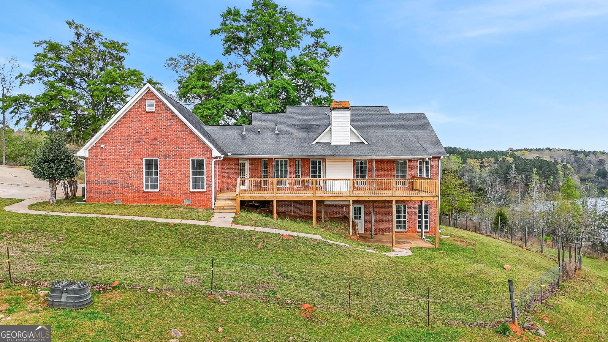 955 Mocassin Gap Road Locust Grove, GA 30248 - Photo 41 of 59 a aerial view of a house with a yard table and chairs