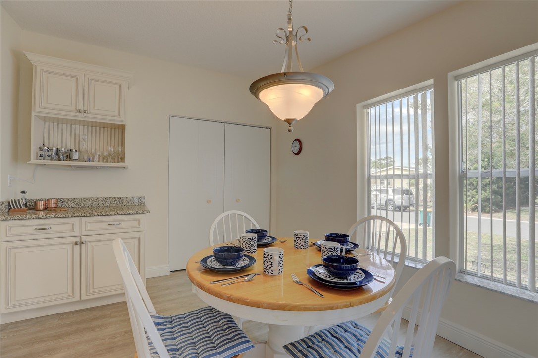 362 Egret Circle Barefoot Bay, FL 32976 - Photo 14 of 36 a table and chairs in a room