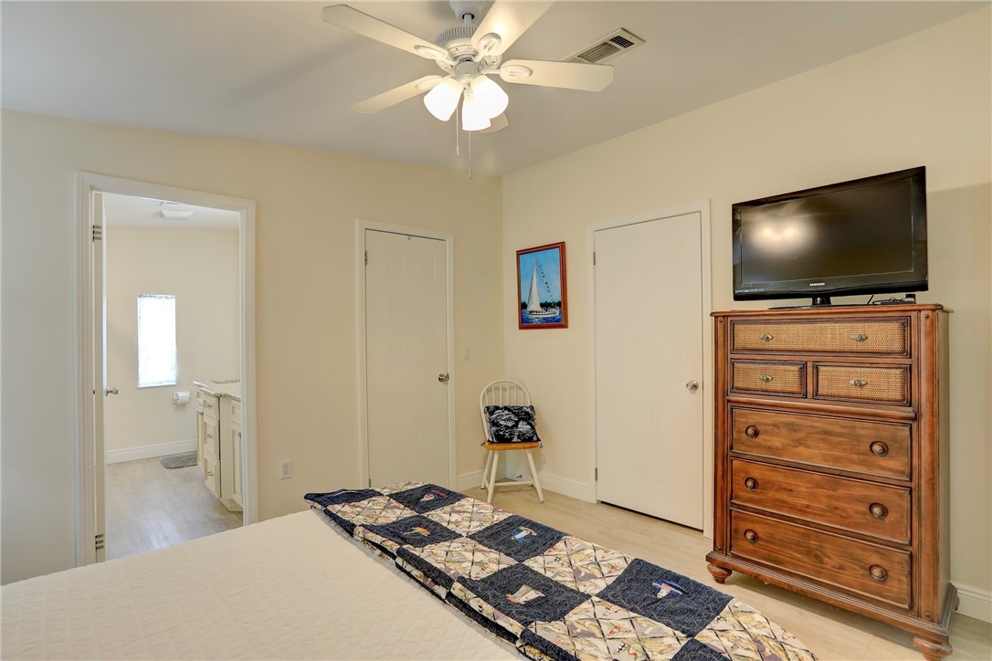 362 Egret Circle Barefoot Bay, FL 32976 - Photo 17 of 36 a living room with furniture and a flat screen tv