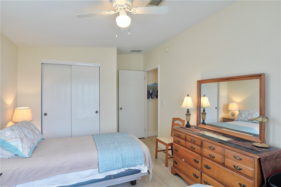 362 Egret Circle Barefoot Bay, FL 32976 - Photo 20 of 36 a bedroom with a bed and wooden floor