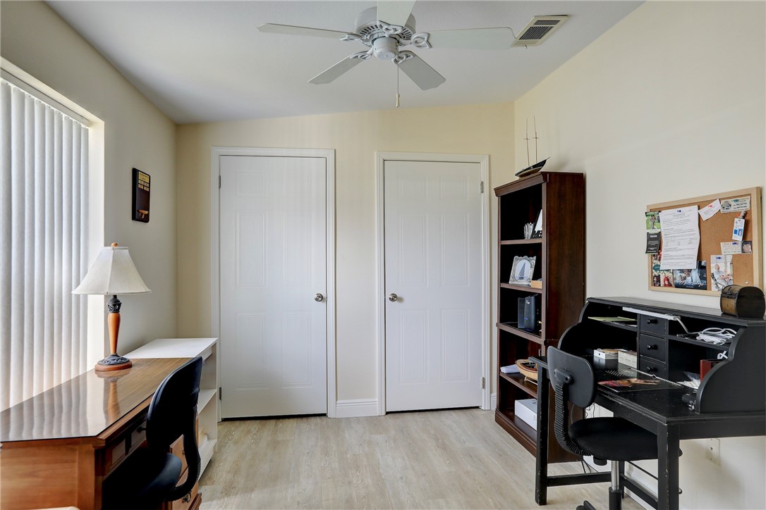 362 Egret Circle Barefoot Bay, FL 32976 - Photo 22 of 36 a view of a workspace with furniture and a window