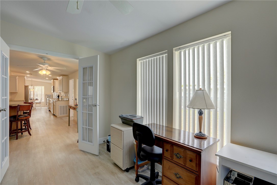362 Egret Circle Barefoot Bay, FL 32976 - Photo 23 of 36 a view of a livingroom with workspace and a window