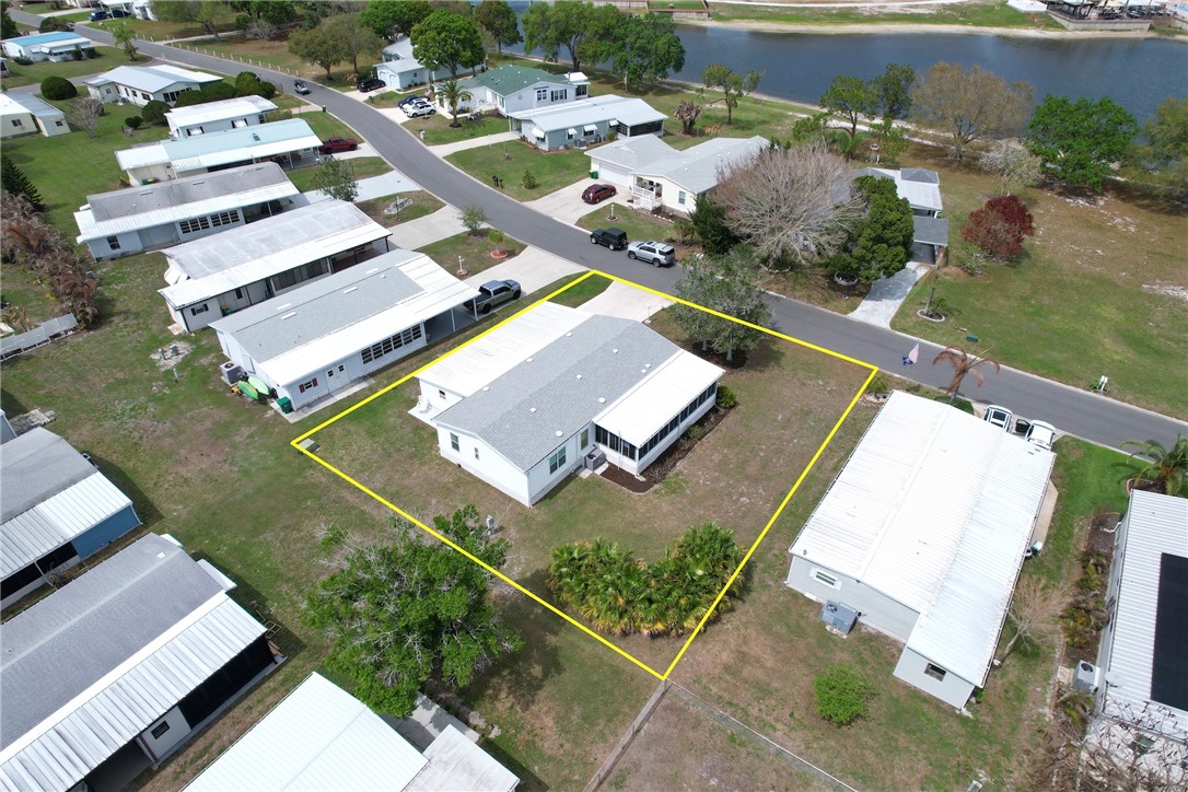 362 Egret Circle Barefoot Bay, FL 32976 - Photo 25 of 36 an aerial view of a house with a garden