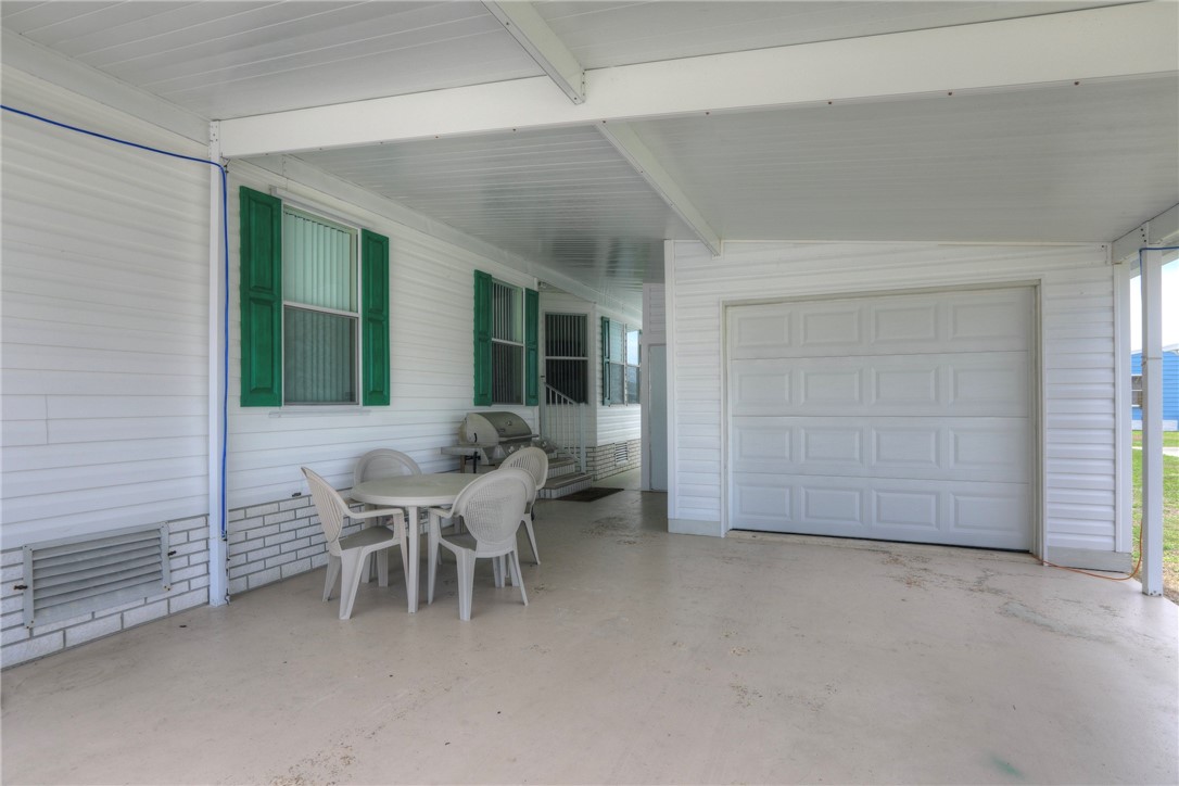 362 Egret Circle Barefoot Bay, FL 32976 - Photo 3 of 36 a view of a dining room with furniture and windows