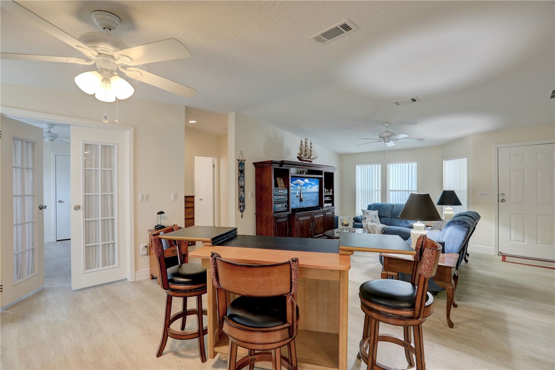 362 Egret Circle Barefoot Bay, FL 32976 - Photo 8 of 36 a view of a dining room with furniture and chandelier