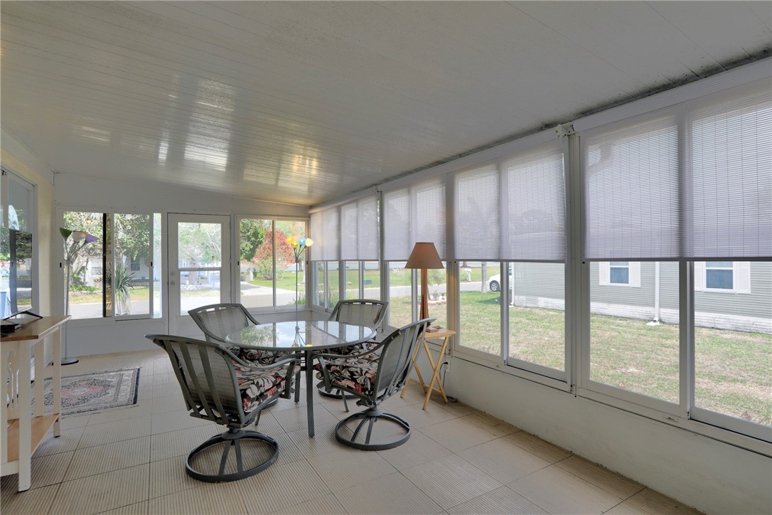 362 Egret Circle Barefoot Bay, FL 32976 - Photo 10 of 36 a view of a dining room with furniture window and outside view