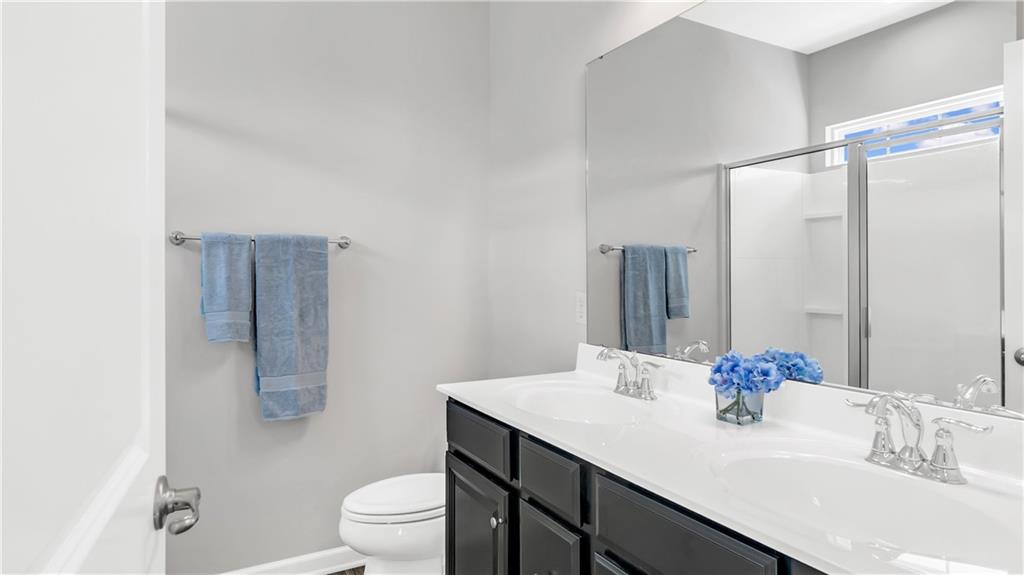 4204 Spruce Road Gibsonia, PA 15044 - Photo 14 of 22 a bathroom with a granite countertop sink toilet and shower