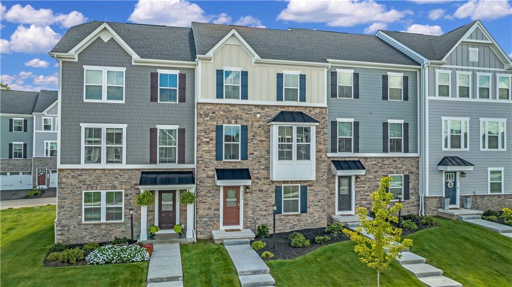 4204 Spruce Road Gibsonia, PA 15044 - Photo 20 of 22 a front view of a residential apartment building with a yard