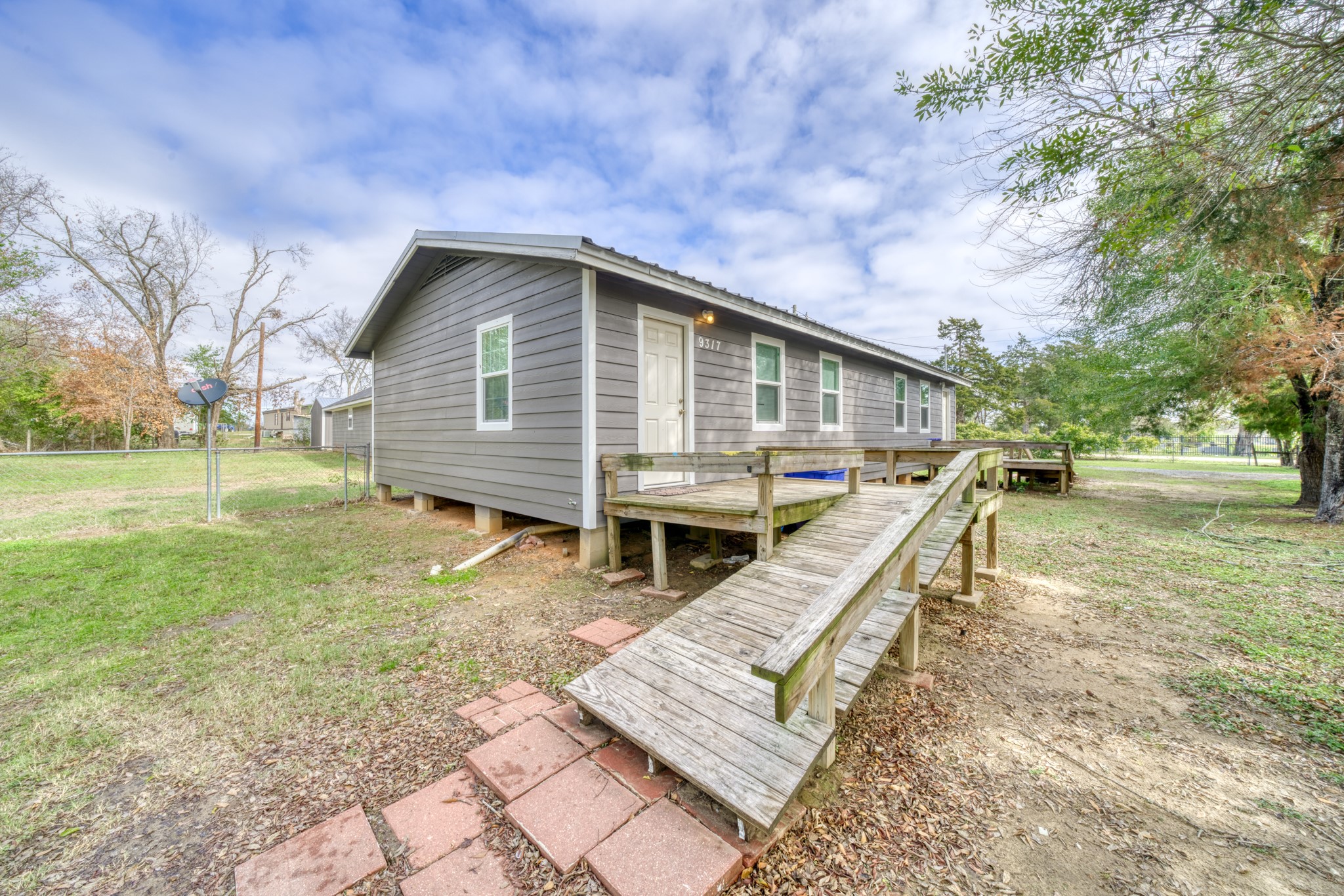 9337 Ash Street Midway, TX 75852 - Photo 25 of 28 a view of a house with a yard