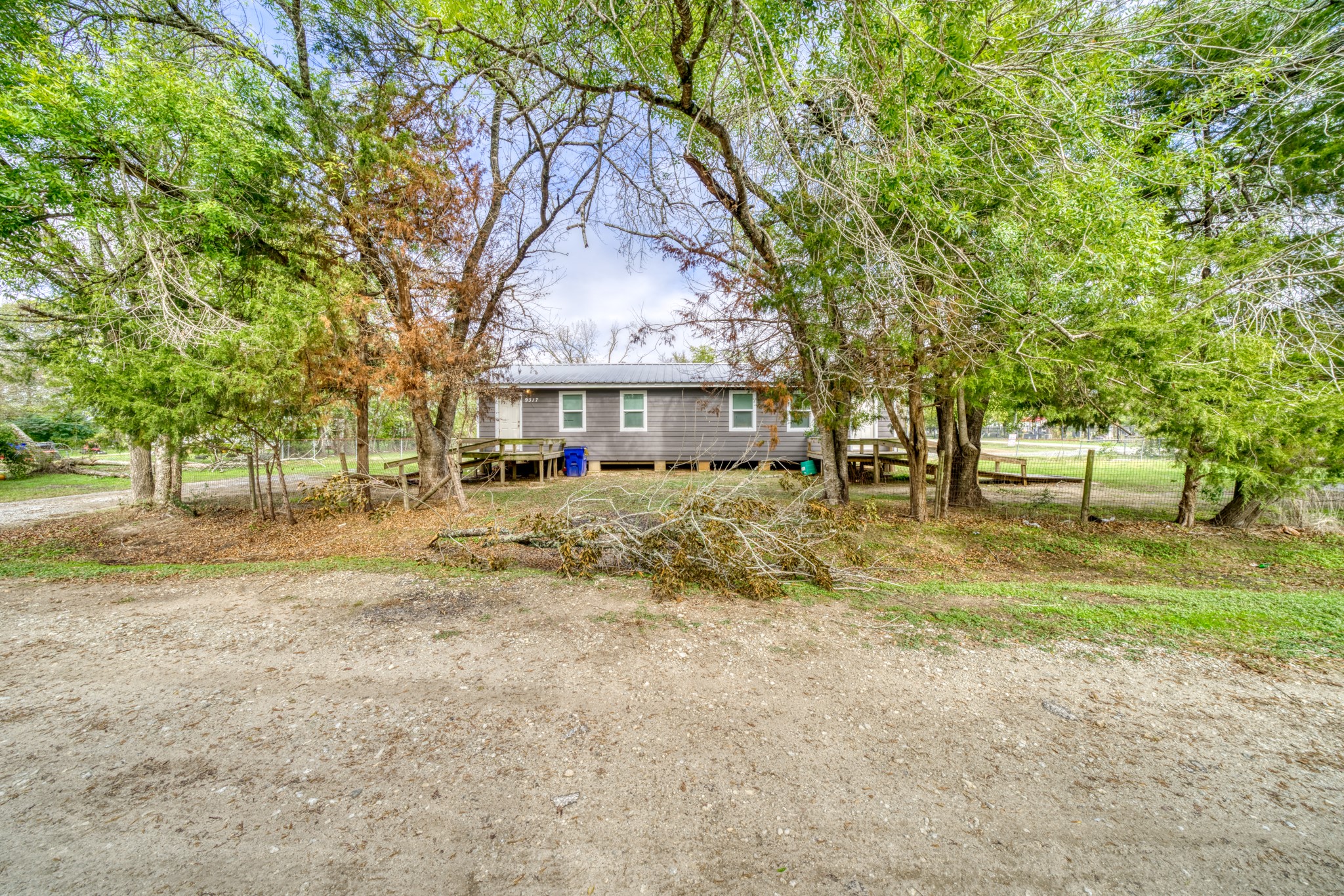 9337 Ash Street Midway, TX 75852 - Photo 27 of 28 a view of a yard with plants and a fountain