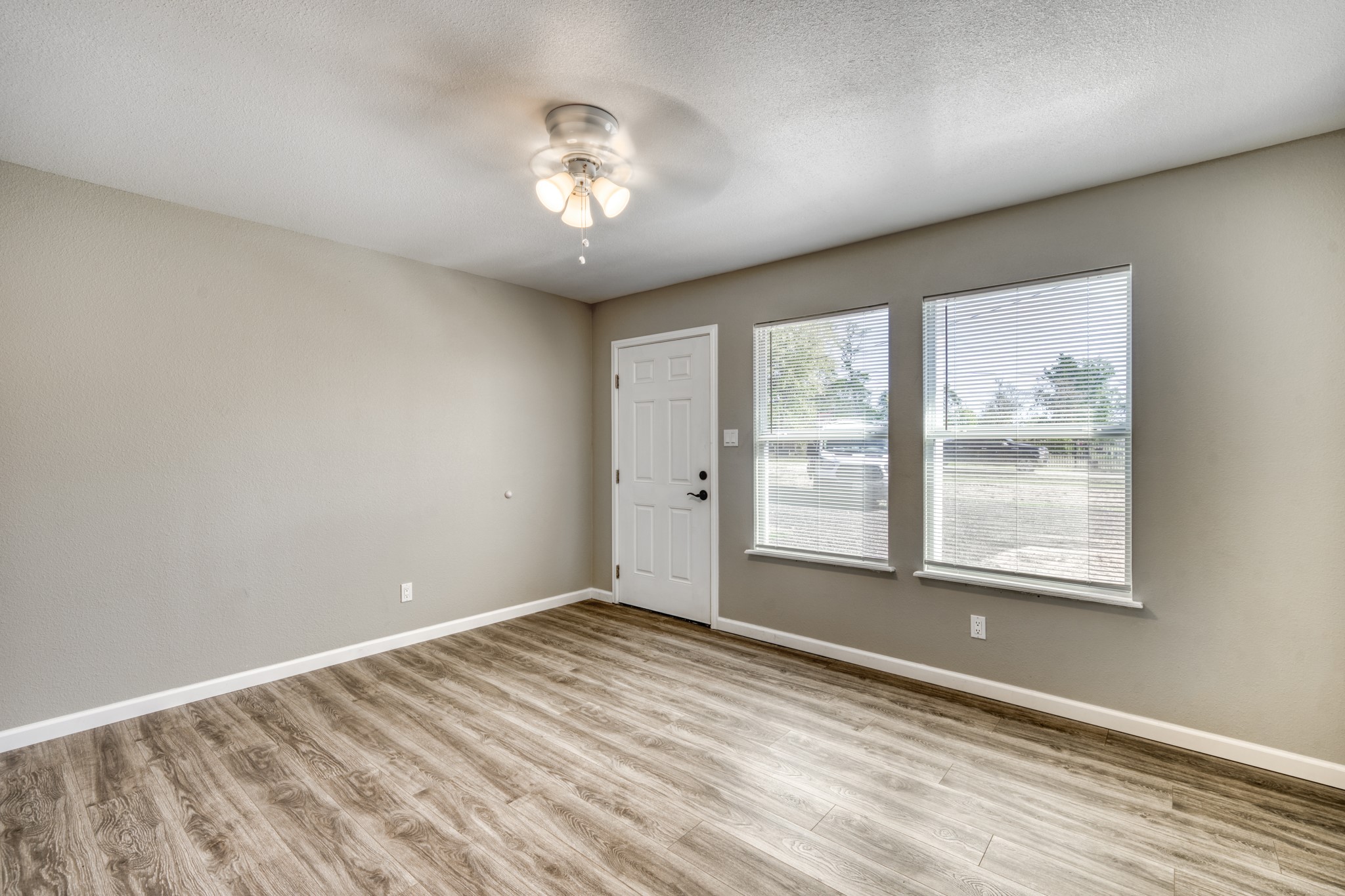 9337 Ash Street Midway, TX 75852 - Photo 6 of 28 an empty room with wooden floor and windows